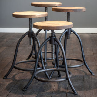 Stool. Classic workshop stool made of steel and wood in Authentic