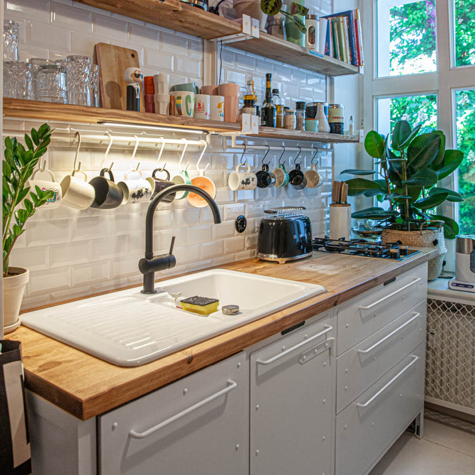 Wooden countertops and customer kitchen in industrial design in white